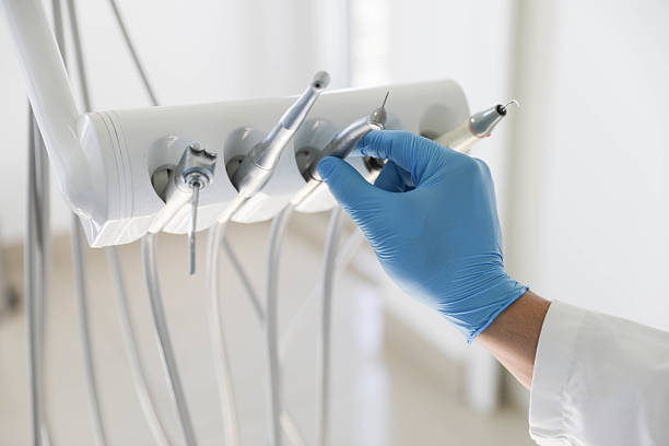 Professional Tooth Extraction technician working in Watergate, FL